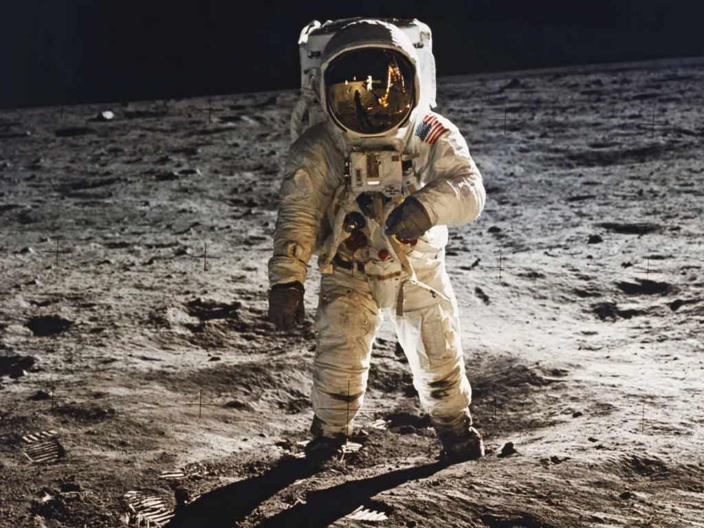 Buzz Aldren walking on the moon in a photograph taken by Neil Armstrong