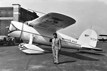 Wiley Post with his plane Winnie Mae